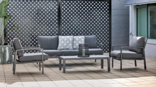 a couch and two chairs and a table on a patio at Market Street Penthouse in Merimbula