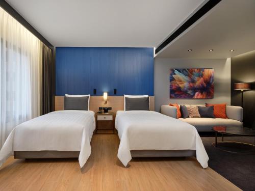 Katil atau katil-katil dalam bilik di Sindhorn Midtown Hotel Bangkok, Vignette Collection by IHG