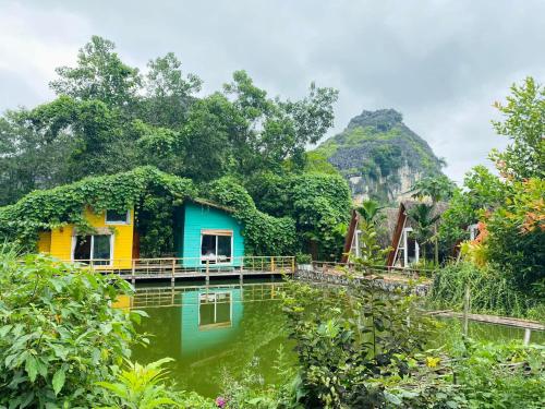 a house in the middle of a body of water at Trang An Lamia Bungalow in Ninh Binh