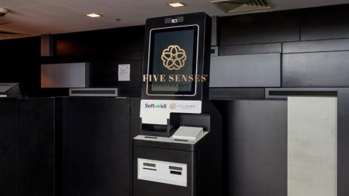 an entrance to a five senses cash register in a room at Dua Sentral Kuala Lumpur by Five Senses in Kuala Lumpur