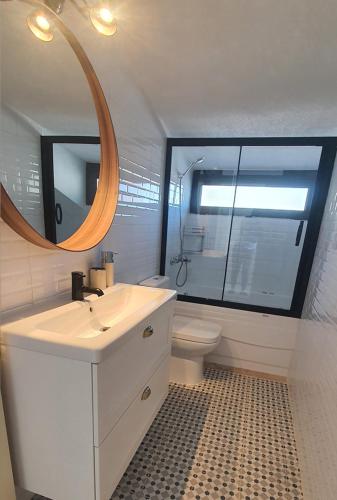 a bathroom with a sink and a mirror and a toilet at Fİ SALDA in Doğanbaba