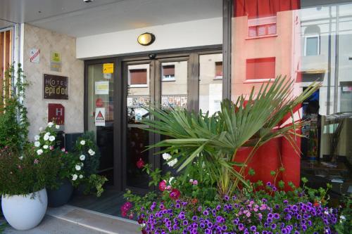 a store front with flowers in front of it at Logis Hotel Epi d'Or in Angoulême