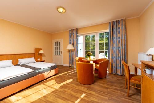 En eller flere senge i et værelse på Waldhotel Humboldt