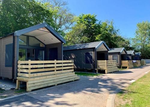 a row of camping huts in a row at Torvean Holiday Park in Inverness