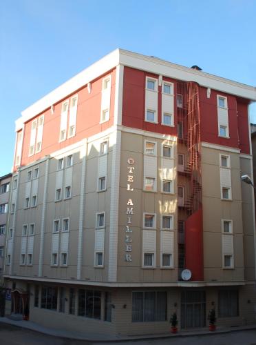 a large building with red and white at OTEL AMİLLER in Erzurum
