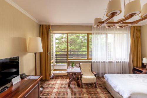 Postel nebo postele na pokoji v ubytování Hotel Arłamów