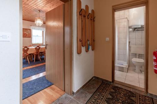 a hallway with a door leading to a dining room at Family Friendly House Marija - Happy Rentals in Gradišča
