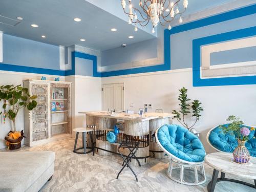 a living room with blue and white walls at Glory island okinawa SOBE in Naha