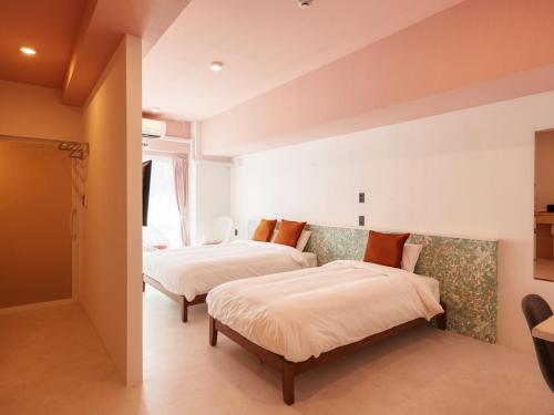 מיטה או מיטות בחדר ב-Glory island okinawa SOBE