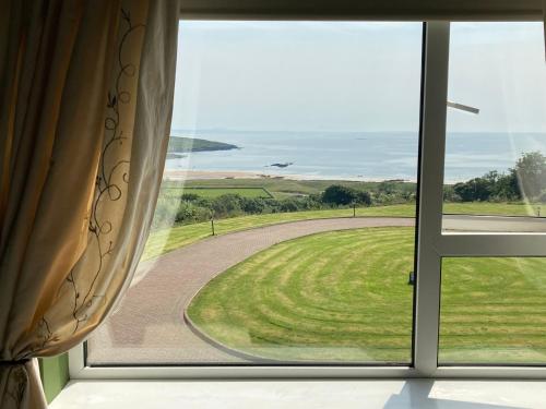 a window with a view of a road at Millfarm House in Killybegs
