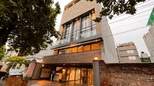 a large brick building with a lot of windows at IP Royal Hotel - New Delhi in New Delhi
