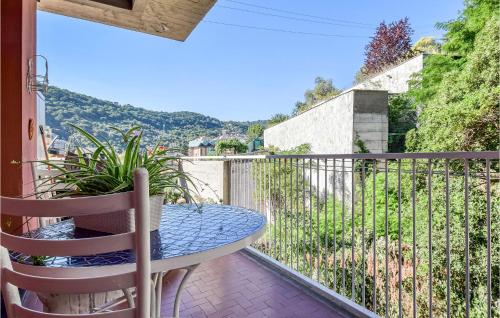 a patio with a table and chairs on a balcony at 1 Bedroom Stunning Apartment In Genova in Genova