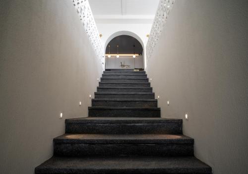 a staircase leading up to a building with lights at Heaven View Krabi SHA in Ao Nam Mao