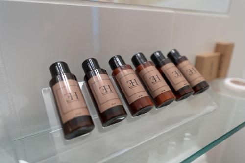 a row of bullets sitting on a shelf at Barbara Piran Beach Hotel in Piran