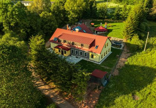an overhead view of a house with a red roof at Chalupa Křenov 62 in Bernartice