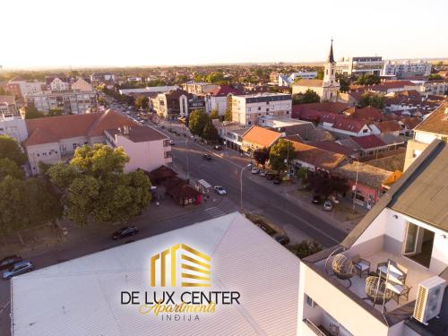 an aerial view of a city with a building at DeLux Center Apartments Inđija in Inđija