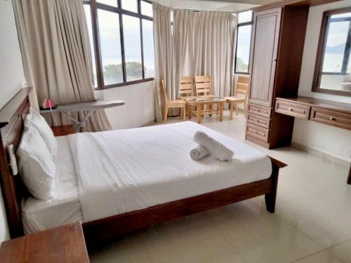 Katil atau katil-katil dalam bilik di Airbnb at Sri Sayang Batu Ferringhi Beach