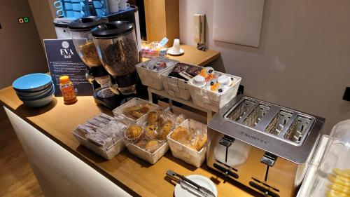 a counter with a bunch of food on it at EVA LUXURY ROOMS CAGLIARI in Cagliari