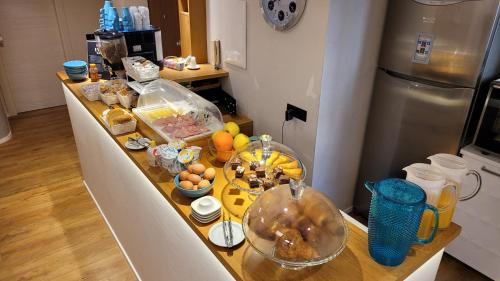 a kitchen counter with a bunch of food on it at EVA LUXURY ROOMS CAGLIARI in Cagliari