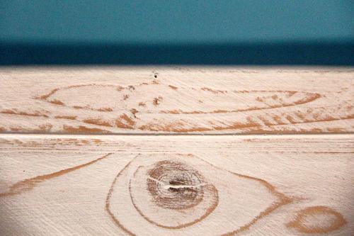 a wooden table with a heart drawn on it at Relais Chambre in Castelfidardo