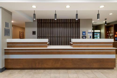 a lobby of a hospital with stairs and a waiting room at Best Western Plus Isanti in Isanti
