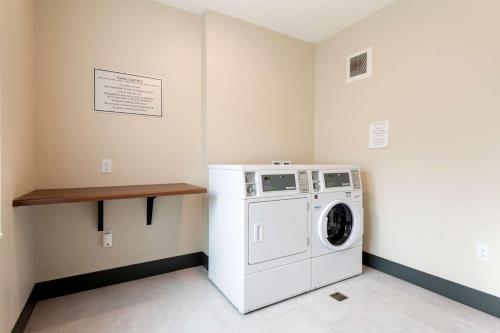 a laundry room with a washer and dryer at Best Western Plus Isanti in Isanti