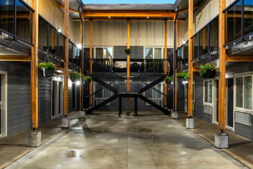 an empty hallway of a building with a spiral staircase at Econo Lodge in Prince George