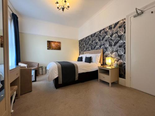 Ένα ή περισσότερα κρεβάτια σε δωμάτιο στο Birkdale Guest House