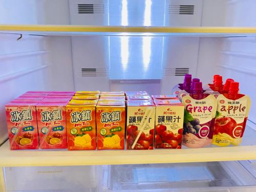 a shelf in a refrigerator filled with lots of food at 艾兒民宿 l 台東包棟 l 按訂房人數開放房間8-21人 in Taitung City