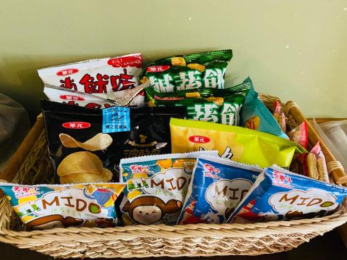 a basket filled with chips and other snacks at 艾兒民宿 l 台東包棟 l 按訂房人數開放房間8-21人 in Taitung City