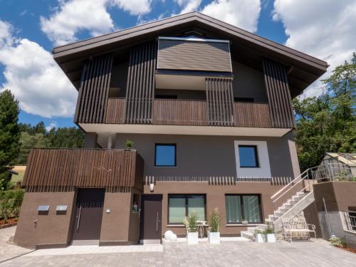 aominium building with a balcony and stairs at Apartment Peskoller in Falzes