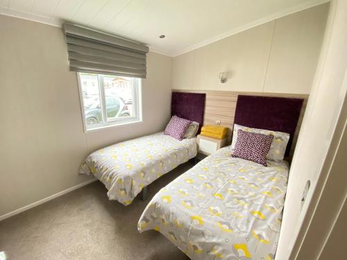 Säng eller sängar i ett rum på Spring Lodge