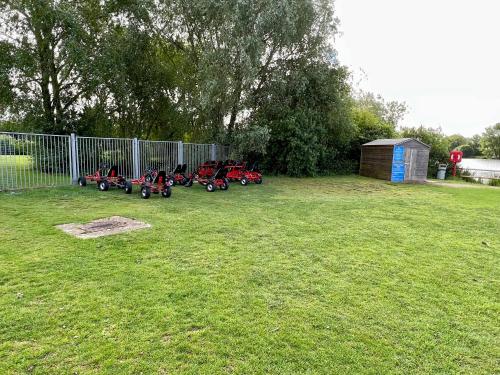 a group of motorcycles parked next to a fence at Spring Lodge in South Cerney