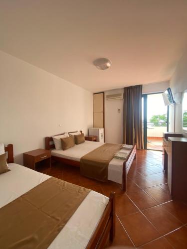 Postel nebo postele na pokoji v ubytování DeLux Apartmani