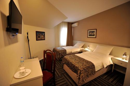 Postel nebo postele na pokoji v ubytování ZP Hotel