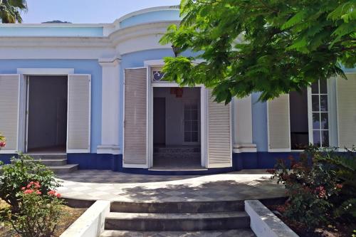 a blue house with stairs in front of it at Casa Isla Bonita in Los Llanos de Aridane