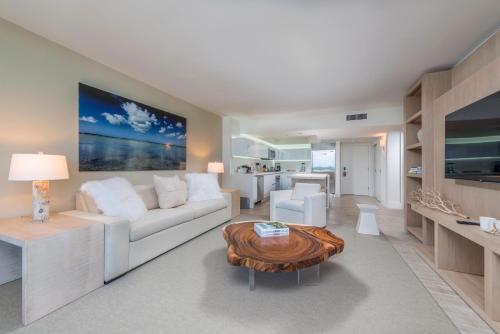 a living room with a white couch and a coffee table at Luxurious Private Condo at 1 Hotel & Homes -1127 in Miami Beach