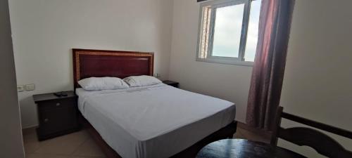 Una cama o camas en una habitación de Hotel Al Andalous