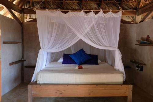 Кровать или кровати в номере Rumah Pampa at Pachamama