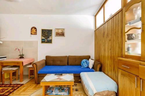 a living room with a couch and a table at Apartman Borislava in Trebinje