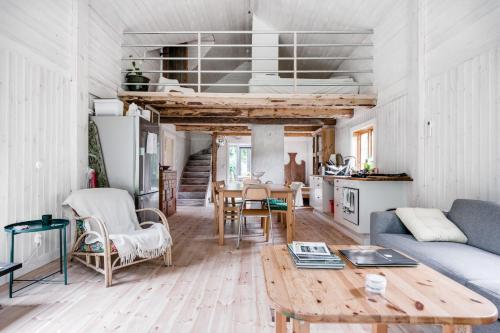 a living room with a couch and a table at Unique holiday home in Mankarbo, Uppsala 