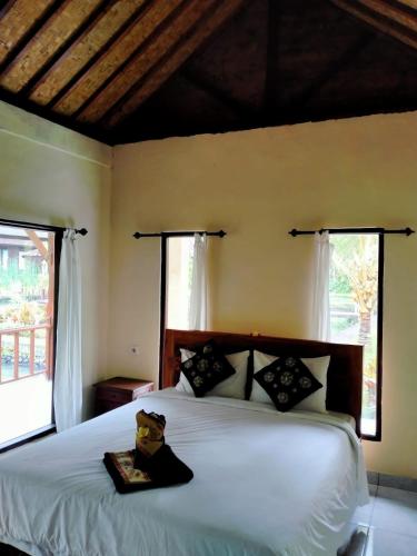 Katil atau katil-katil dalam bilik di Villa Uma Ayu Sidemen