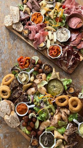 a bunch of different types of food on a table at Tropic Hôtel in Rivesaltes