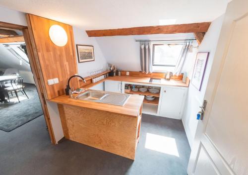 a small kitchen with a sink and a stove at Pension Rokytka in Kryštofovo Údolí