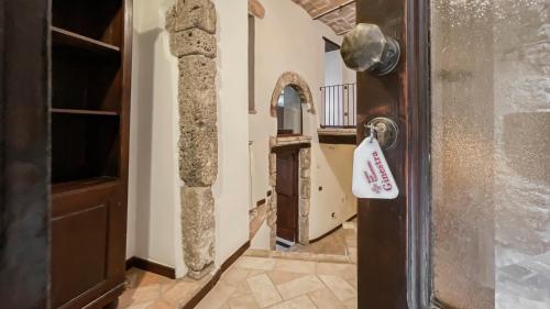 a house with a door with a price tag on it at Borgo San Valentino in Arrone