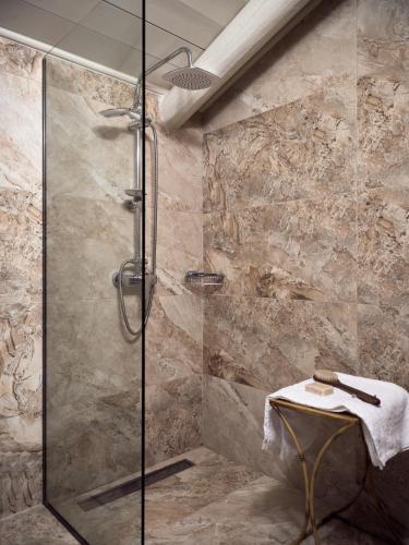 a bathroom with a glass shower with a sink at Conte Nobile Villa, a Rejuvenating Retreat, By ThinkVilla in Vasilikos
