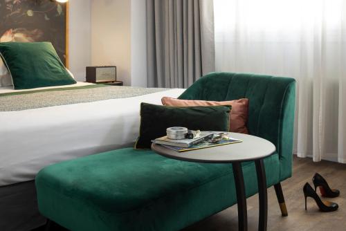 Un ou plusieurs lits dans un hébergement de l'établissement Hôtel Edmond W Lyon Part-Dieu