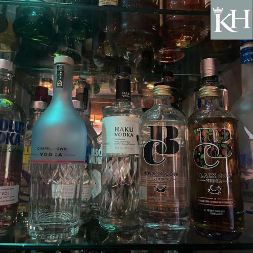 a display of bottles of alcohol on a shelf at Kings Head - Riverside, Ravenstonedale in Ravenstonedale