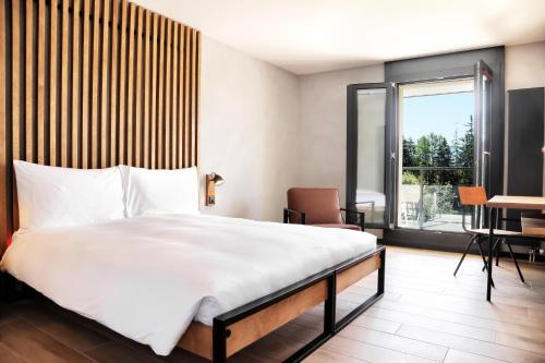 Postel nebo postele na pokoji v ubytování Alaïa Lodge