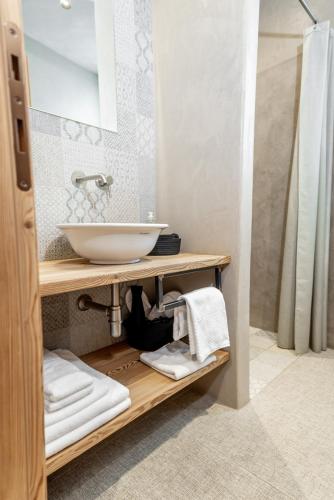 a bathroom with a sink and a mirror at Curt di Clement Eco Mobility Hotel in Tirano